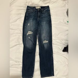 High waisted dark blue wash Abercrombie mom jeans. Distressed in the knees.